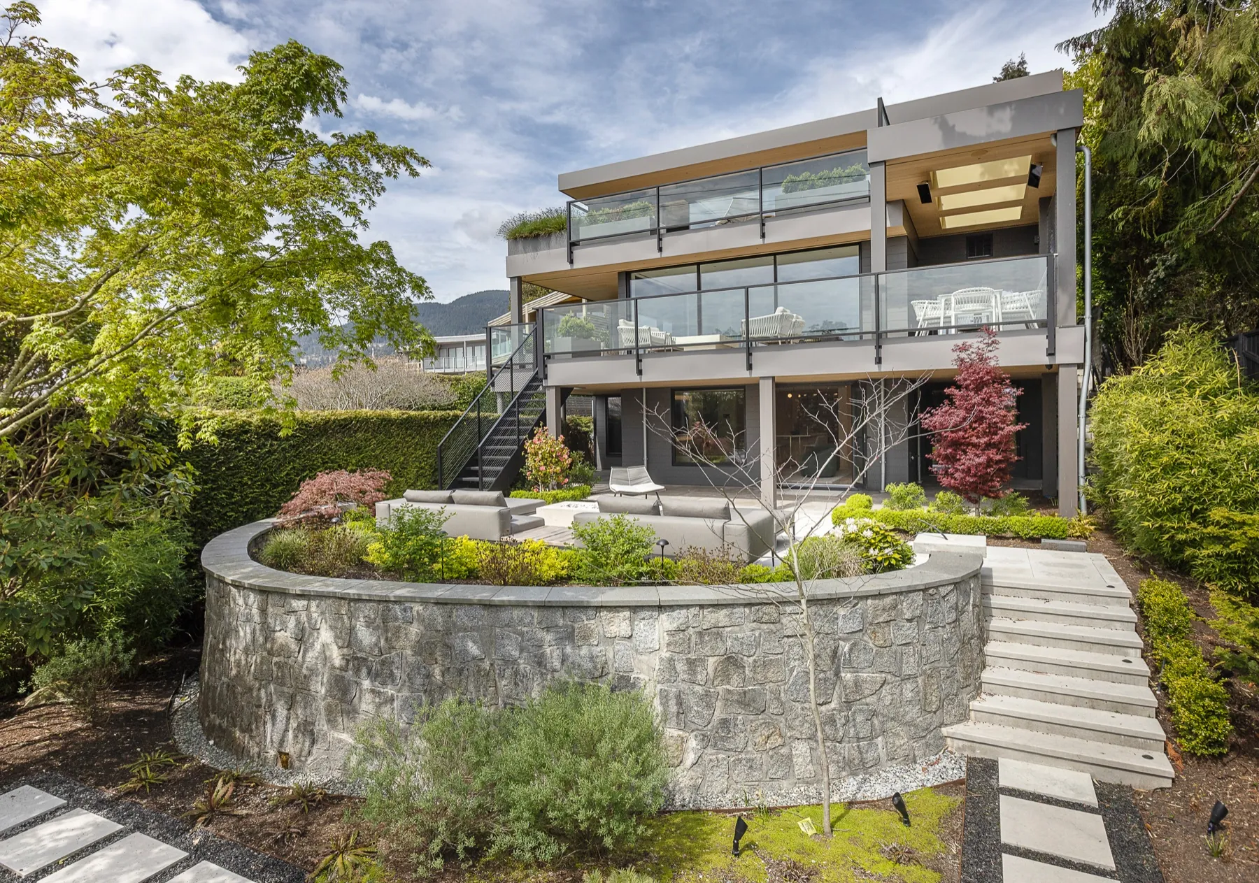 Shoreline, rear exterior and terraced garden