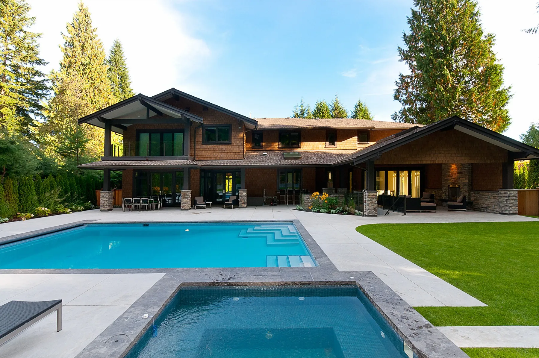 Custom home rear exterior with pool